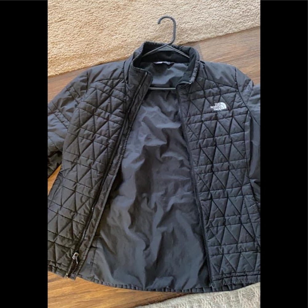 Woman’s large Northface Puffy coat